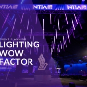 Motorised kinetic lighting fixtures moving above a corporate ballroom.