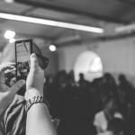 Woman taking a photo with phone