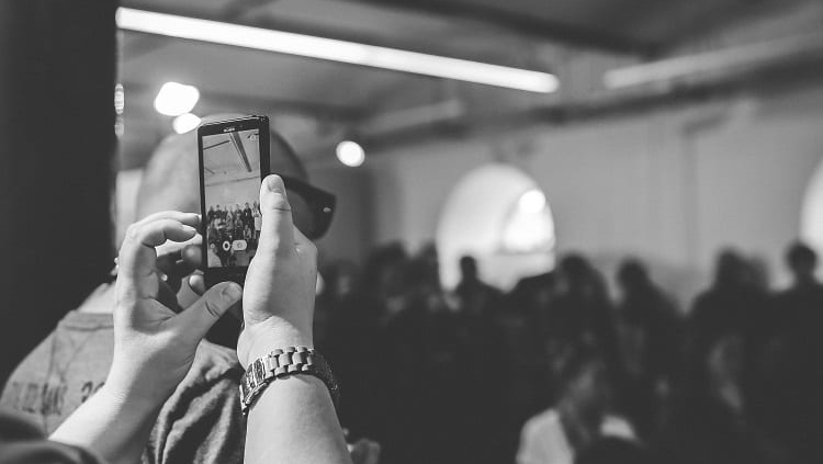 Woman taking a photo with phone