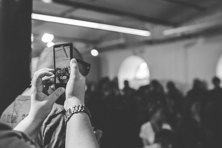 Woman taking a photo with phone