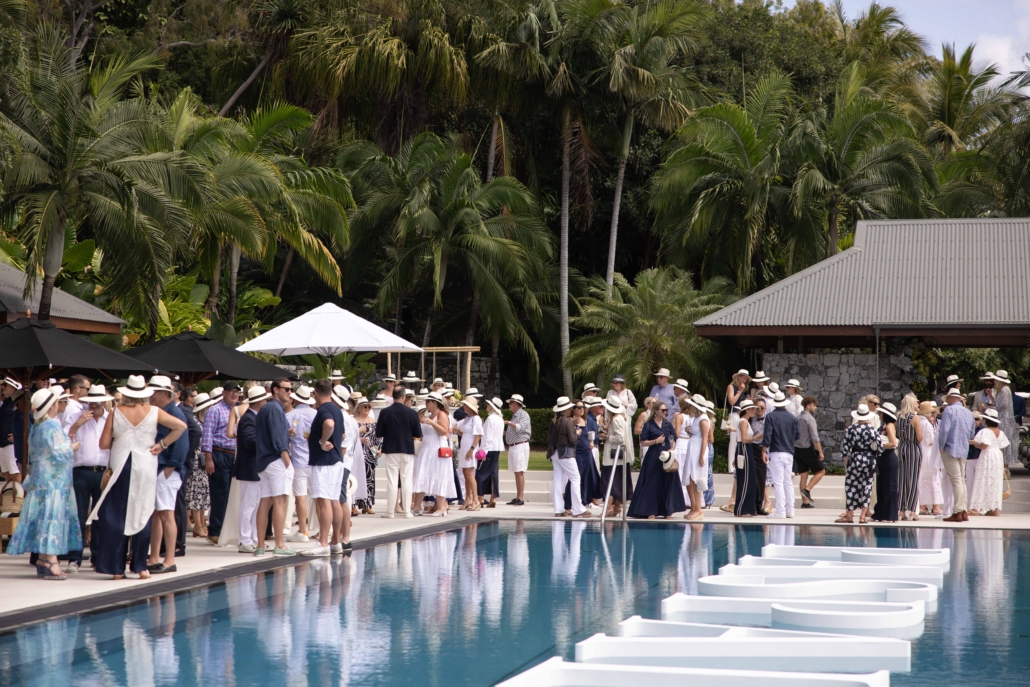 Guests enjoy a poolside Christmas party