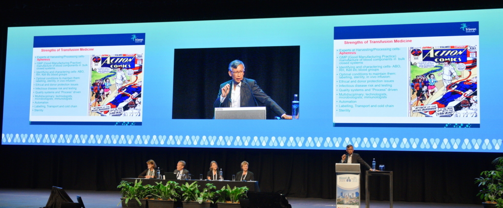 an expert delivers a conference presentation on stage in a large venue 
