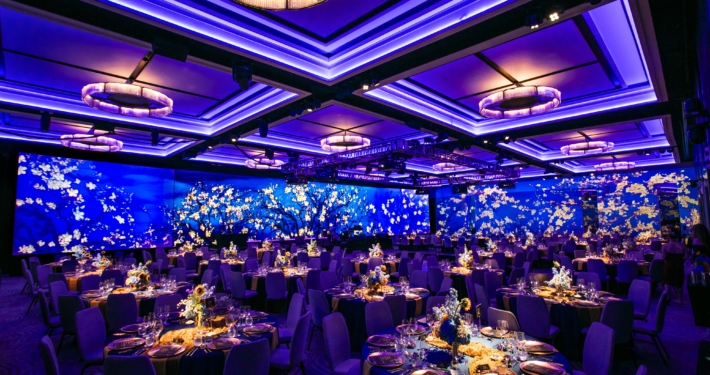 Function room av installation with ultra-wide LED screen and image wall projections.